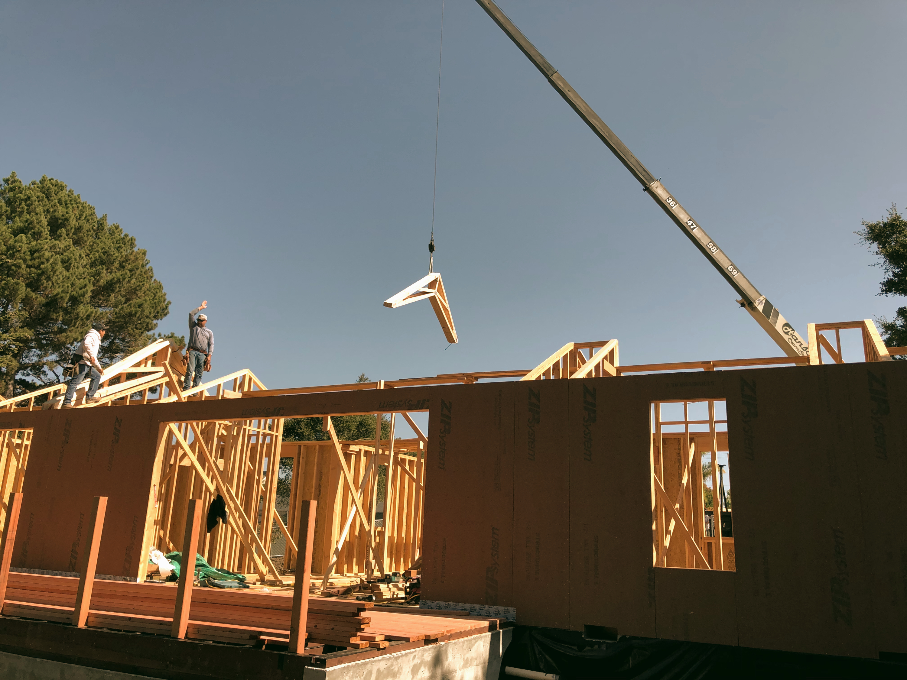 Residential framing and truss installation in progress